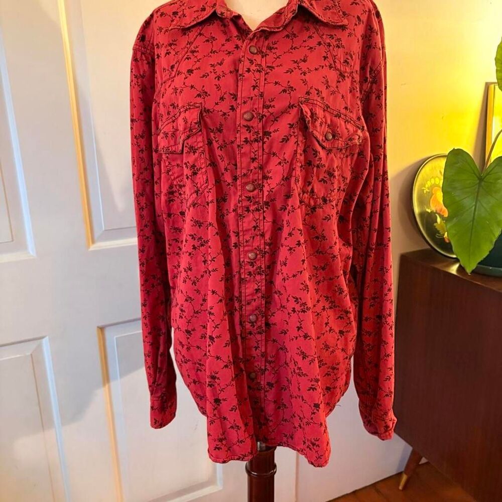 Red cotton pearl snap shirt with dark blue foliage print and a western vibe